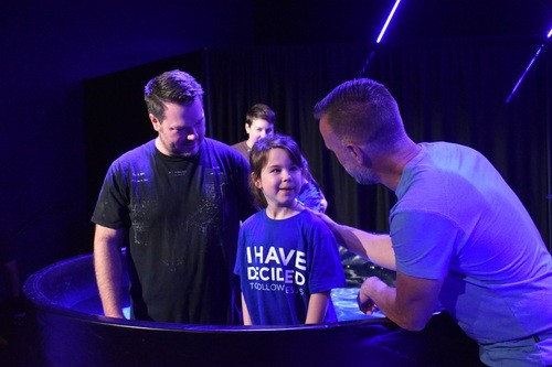 A child getting baptized at Crossroads Church