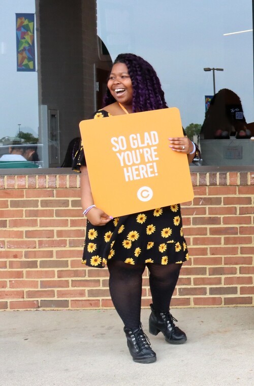 Church member embracing new visitors for church