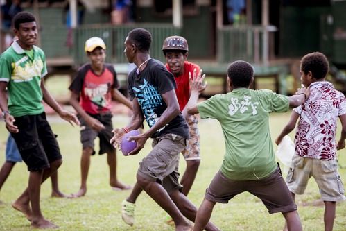 a group of young teens in florida city floriday playing outside in the church yard