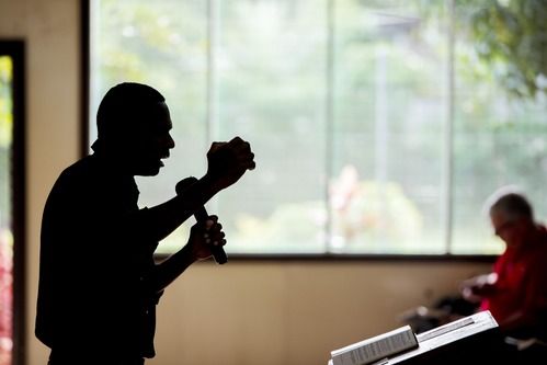 pastor victor hickson preaching from the pulpit at full deliverance baptist church