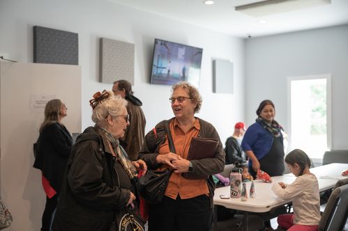 photo of attendees in the fellowship hall following a Sunday morning service