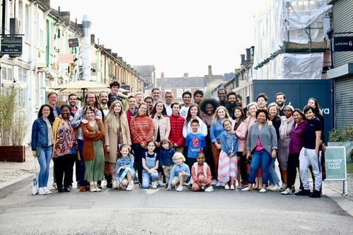 Church community group gathered for a church plant celebration supported by Restoration City Church.