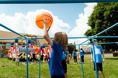 Playing 9 Square on the lawn