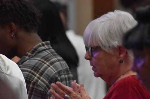 Woman worshipping at the altar