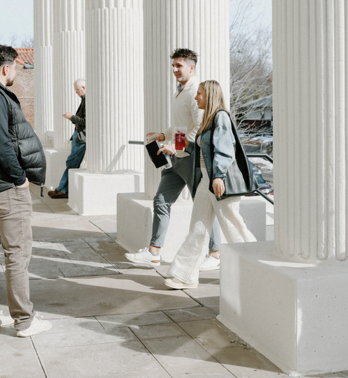 a woman leading worship with her eyes closed and hand raised