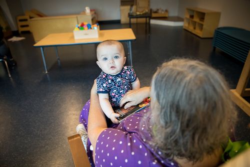 Serve team member holding a baby boy