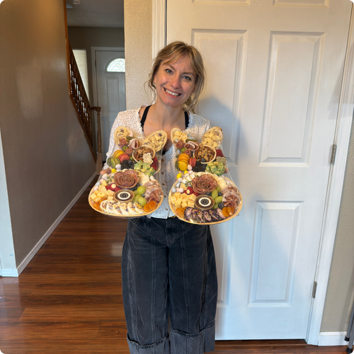 Samantha Carey with charcuterie boards for Mariah's Mission