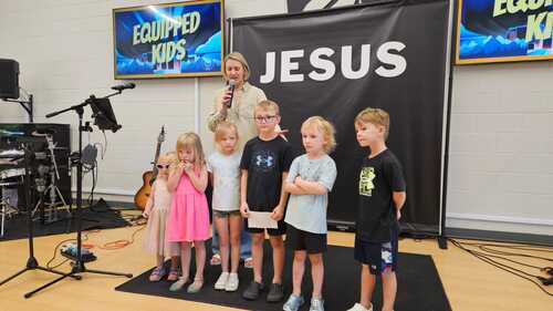 Praying for our kids before kid's church at Equipped Church Highlands Ranch, CO