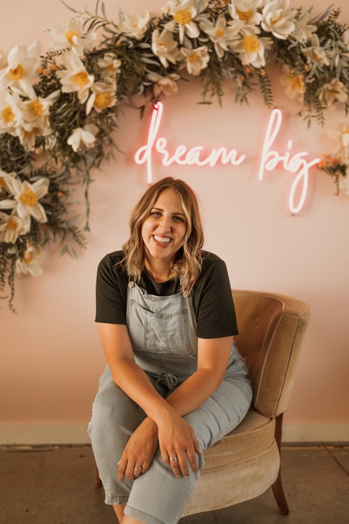 Aubrey posing with a camera