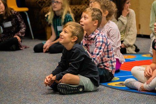 Group of children watching teacher in Children's Church
