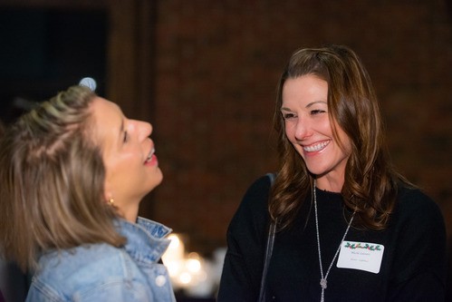 Two women laughing together