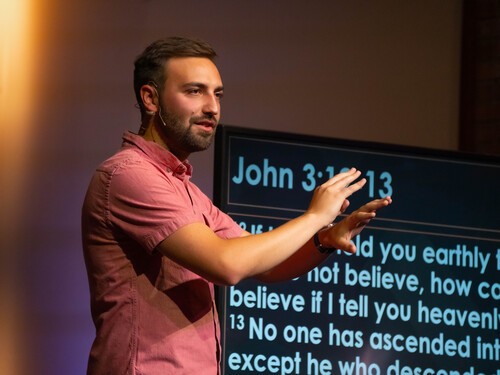 Pastor PJ Aarsvold preaching in the worship center