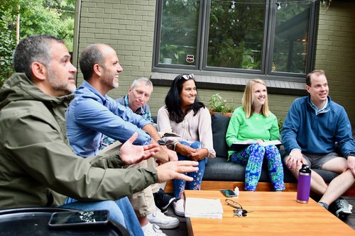 Group of people meeting together outside