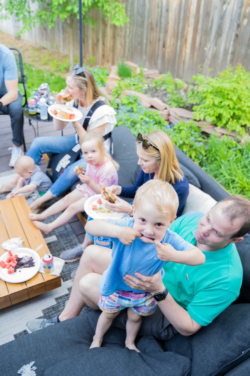 Group of people eating together outside