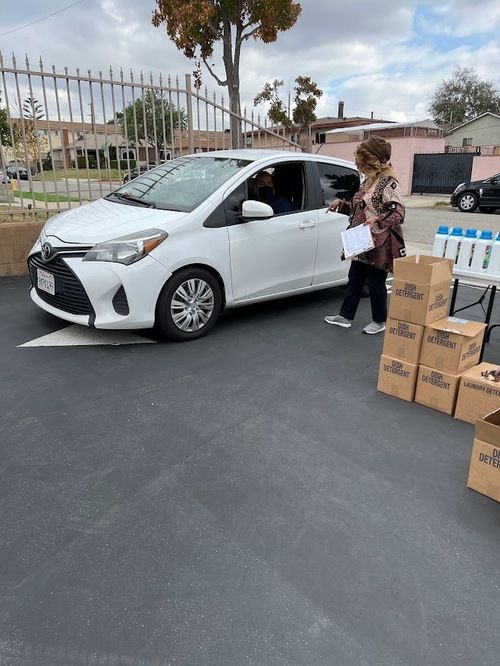 Min. Delores Lakey-Stewart leads volunteers in drive-thru food pantry activities