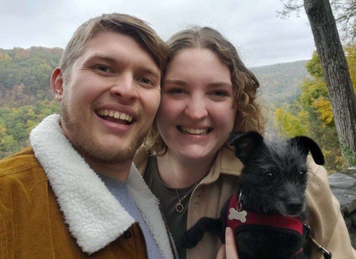 Picture of Lead Pastor Kathryn with her husband Collin and do Hubert, set in the mountains of upstate NY.