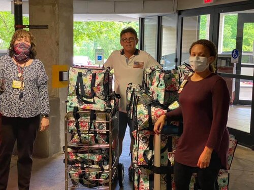 Volunteer assisting cancer patients with emotional and practical support