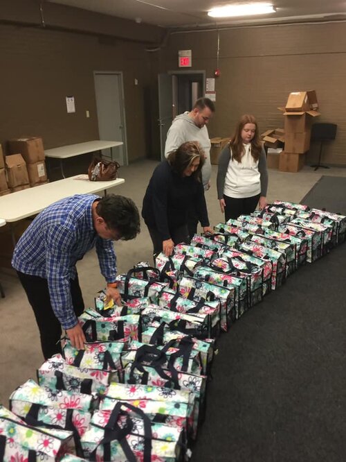 Volunteer helping cancer patients through nonprofit support services